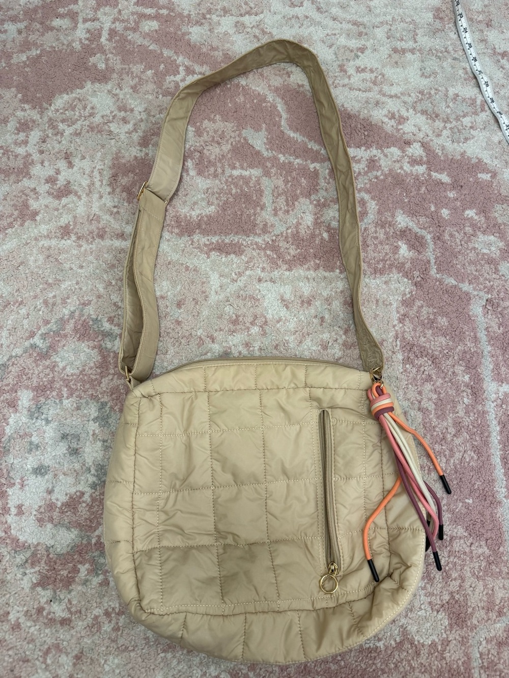 Quilted Beige Crossbody Bag with Colorful Tassel Accent